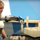 A girl builds blocks with a prosthetic arm.